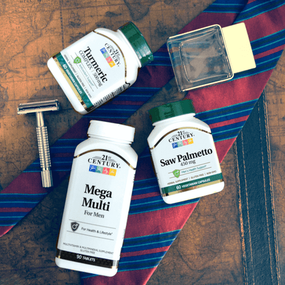 A group shot with a bottle of 21st Century Saw Palmetto 450 mg vegetarian capsules, Mega Multi Mens and Turmeric 500 mg Complex with a tie and men's razor.