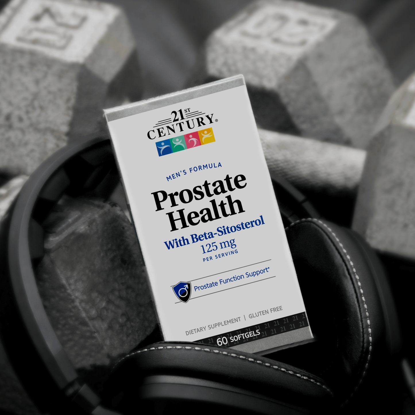 A box of 21st Century Prostate Health with Beta-Sitosterol 125 mg per serving softgels in a back next to 20 pound dumbbells.