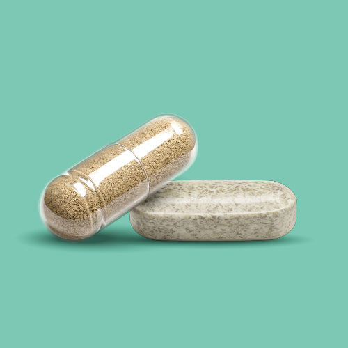 Brown capsule and beige tablet stacked on top of each other.