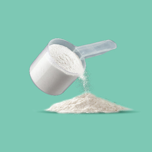 White plastic powder scoop pouring powder.