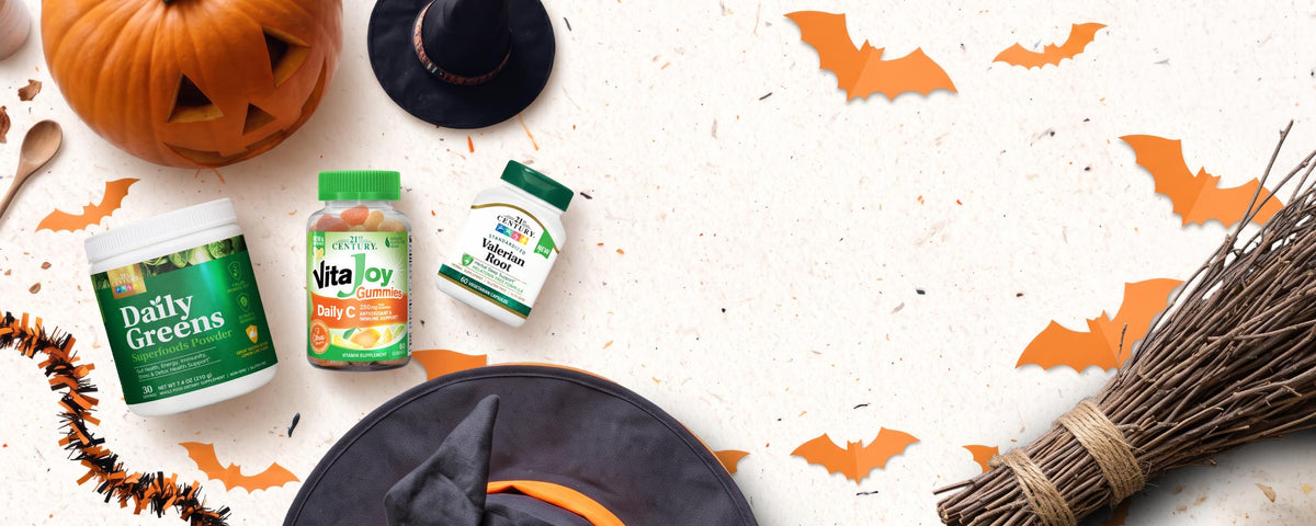 Top down view of supplement products surrounded by Halloween theme items.