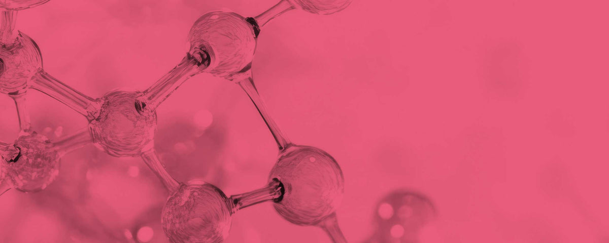 A pink-tinted close-up of a translucent molecular or glass-like structure with rounded nodes connected by thin lines, set against a solid pink background.