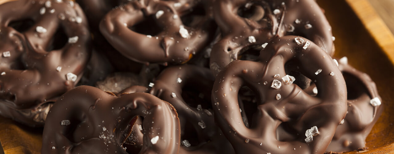 A delicious stack of chocolate covered pretzels.