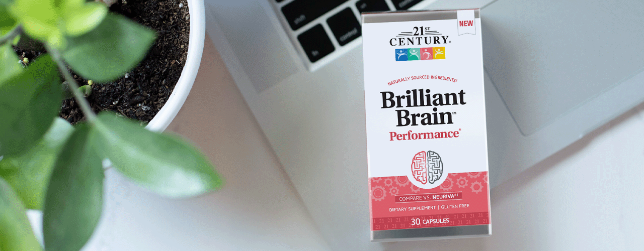 A box of 21st Century's Brilliant Brain sitting on a crossword puzzle.