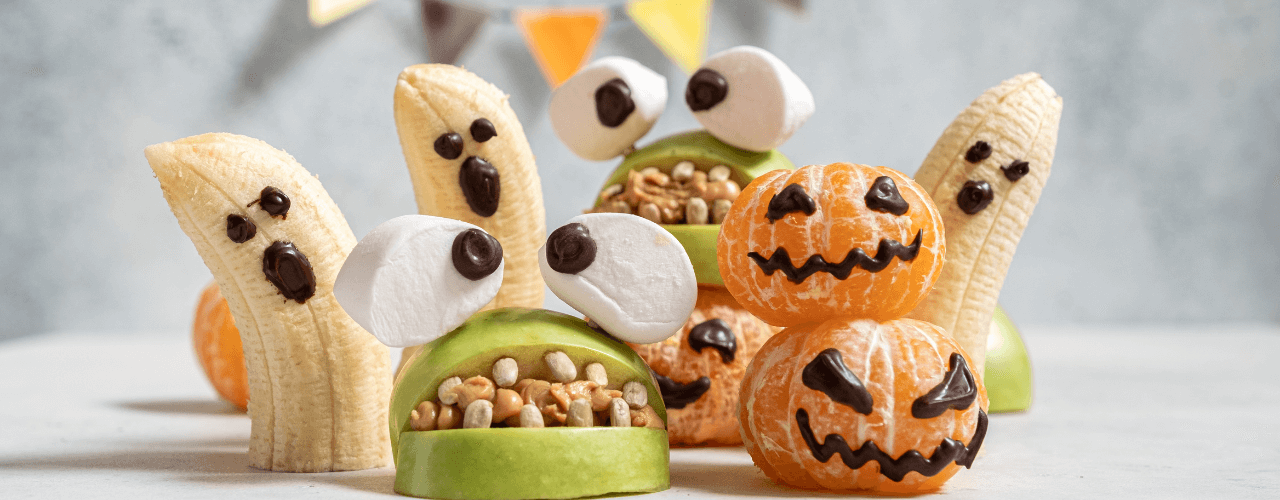 Scary halloween ghost treats made from apples and bananas