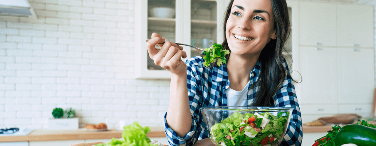 Picture of Woman eating leafy greens