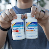 Man holding a bottle of 21st Century Calcium Citrate Maximum and a bottle of Calcium Citrate Petites plus D3.