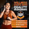 A photo of a woman in a gym in a sports bra and workout pants listening to music with ear buds, the copy wellness starts with quality ingredients, an image of a trust quality seal, and the nutrition claims no artificial flavors, no artificial sweeteners, no milk or lactose, and gluten free.